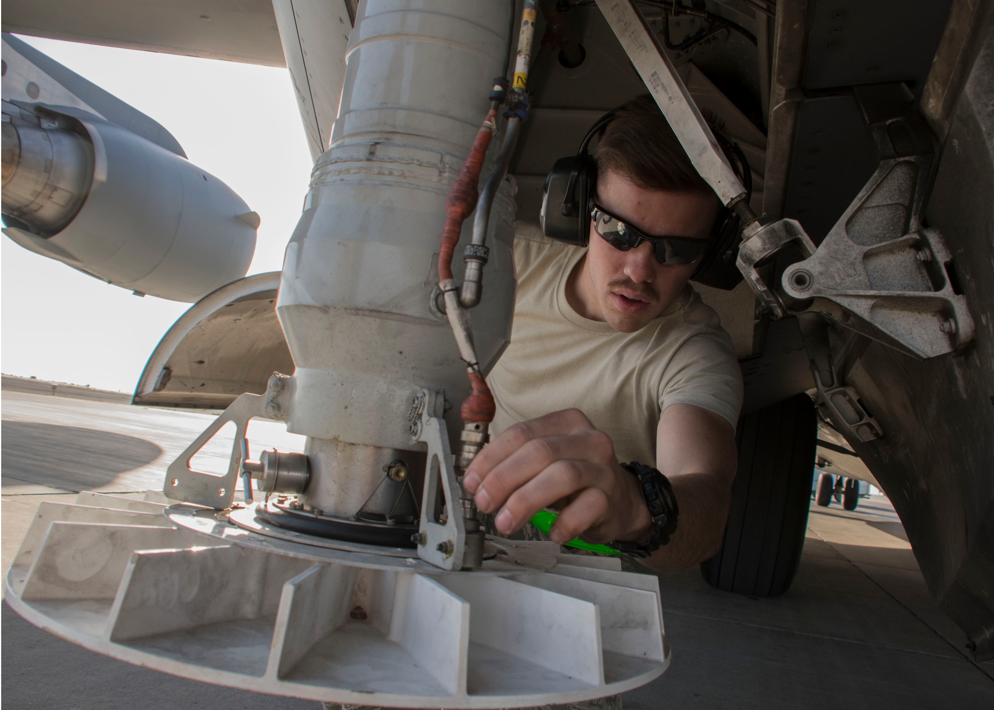 Airman 1st Class Nathan Travis, a 5th Expeditionary Air Mobility Squadron aircraft electrical and environment systems journeyman, inspects wiring on the stabilizer strut of a C-17 Globemaster III at an undisclosed location in Southwest Asia Jan. 13, 2017. Crew chiefs from the small squadron rely on specialists such as electricians to help out with inspections. (U.S. Air Force photo/Senior Airman Andrew Park)