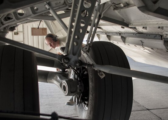 Tech. Sgt. Brian Maggard, a 5th Expeditionary Air Mobility Squadron aerospace maintenance craftsman, inspects the tires of a C-17 Globemaster III during a post-flight inspection at an undisclosed location in Southwest Asia Jan. 13, 2017. Tires usually wear out quickly on Globemasters as their missions often require landing on gravel or dirt runways in austere locations to deliver supplies and personnel. (U.S. Air Force photo/Senior Airman Andrew Park)