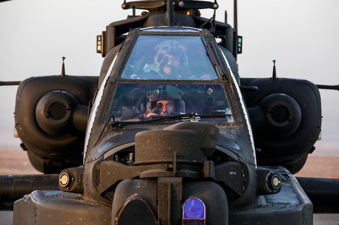 U.S. Soldiers from Bravo Troop, 4th Squadron, 6th Calvary Regiment, Task Force Saber conduct pre-flight on an AH 64E Apache helicopter at Camp Erbil, Iraq, Jan. 10, 2017. U.S. Army Aviation are enabling partnered forces to defeat ISIL by providing air support on the battlefield. Combined Joint Task Force – Operation Inherent Resolve is the global Coalition to destroy ISIL Combined Joint Task Force - Operation Inherent Resolve is the global Coalition to defeat ISIL in Iraqi and Syria. (U.S. Army photo by Spc. Craig Jensen)