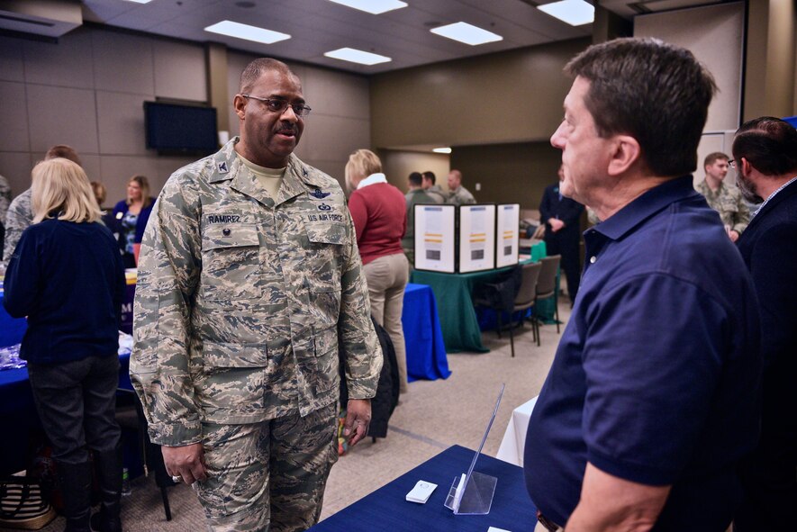 Colonel Esteban L. “Esty” Ramirez, the vice commander of the 932d Airlift Wing, thanks an employer for coming out to the recent Job and Education Fair held inside the 932nd AW headquarters building at Scott Air Force Base, Ill.  Companies and colleges set up tables and gave out information to unit members to help them consider future options January 7, 2017. The wing flies the C-40C aircraft and is the premier distinguished visitor airlift operation in the Air Force Reserve Command.  With over 1,000 members, the wing equips trains and organizes a ready force of Citizen Airmen to support and maintain all facets of air base operations involving infrastructure and security.  (U.S. Air Force photo by Tech. Sgt. Christopher Parr)
