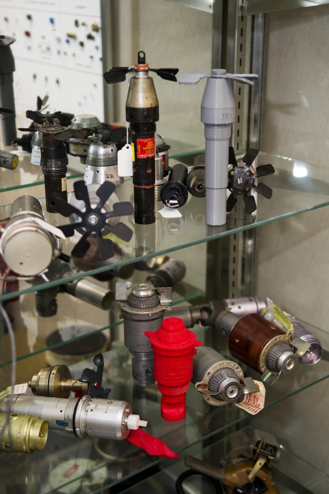 Explosive ordnance training aids sit in a display case at the 4th Civil Engineer Squadron Explosive Ordnance Disposal flight, Dec. 14, 2016, at Seymour Johnson Air Force Base, North Carolina. The EOD flight utilizes a 3-D printer to create plastic models of real training aids to be used in training exercises. (U.S. Air Force photo by Airman Shawna L. Keyes)