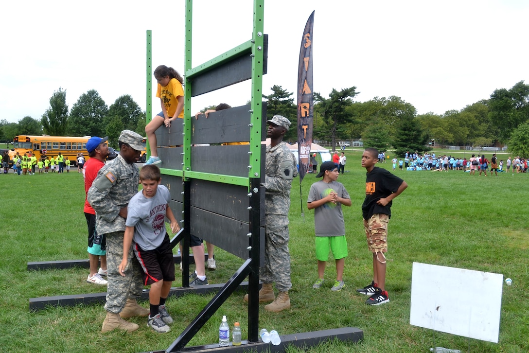 DLA Troop Support active duty personnel were among nearly 40 military personnel to help local children complete seven obstacle courses during the Philly Play Summer Challenge August 10, 2016  in Northeast Philadelphia. More than 2,000 local children participated in the event, aimed at encouraging teamwork and physical fitness.