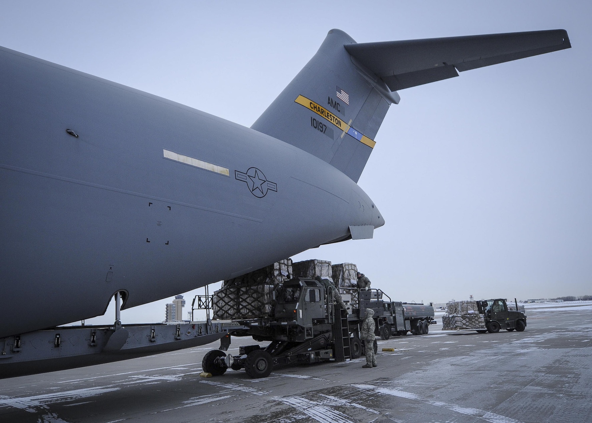 934th Airlift Wing Airmen load humanitarian cargo onto a Joint Base Charleston C-17 Globemaster III at Minneapolis-St Paul Air Reserve Station, Minnesota Jan. 13, 2017.  The 315th AW aircrew delivered the cargo to Ramstein Air Base, Germany where is will await delivery into northern Iraq to Kurdish refugees. (U.S. Air Force photo by Senior Airman Tom Brading)