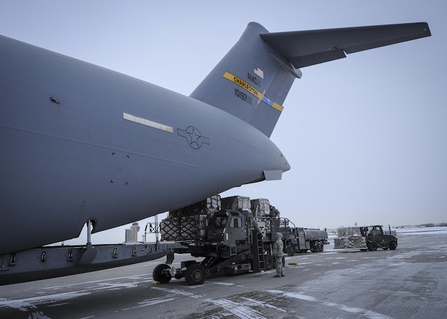 934th Airlift Wing Airmen load humanitarian cargo onto a Joint Base Charleston C-17 Globemaster III at Minneapolis-St Paul Air Reserve Station, Minnesota Jan. 13, 2017.  The 315th AW aircrew delivered the cargo to Ramstein Air Base, Germany where is will await delivery into northern Iraq to Kurdish refugees. (U.S. Air Force photo by Senior Airman Tom Brading)