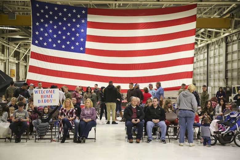 Family and friends wait patiently for their loved ones to arrive aboard Marine Corps Air Station Cherry Point, Jan. 16, 2017. Marines assigned to Marine Attack Squadron 542, Marine Aircraft Group 14, 2nd Marine Aircraft Wing were deployed with the 31st Marine Expeditionary Unit since June, 2016. The 31st MEU is the only continuously forward-deployed MEU. (U.S. Marine Corps photo by Lance Cpl. Cody Lemons/Released)