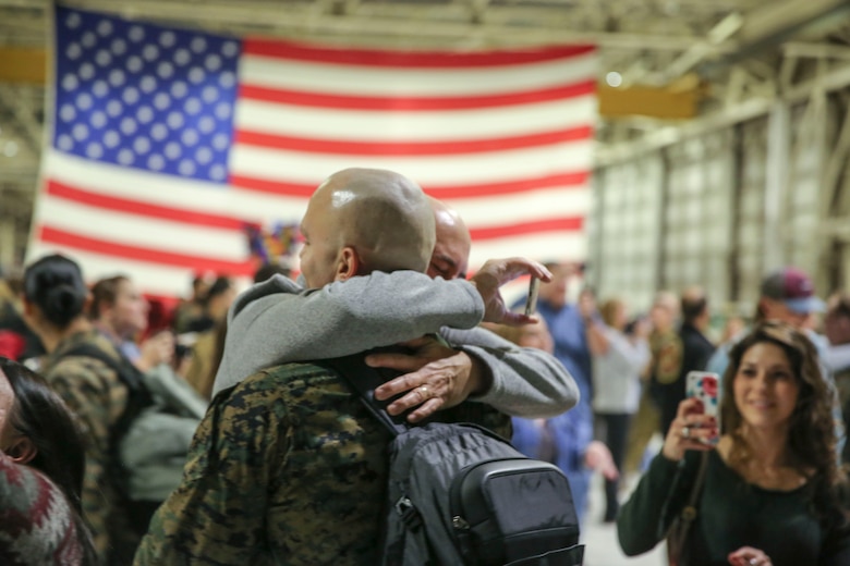 Sgt. Nicholas Christopoulas is reunited with his family aboard Marine Corps Air Station Cherry Point, Jan. 17, 2017. Marines assigned to Marine Attack Squadron 542, Marine Aircraft Group 14, 2nd Marine Aircraft Wing were deployed with the 31st Marine Expeditionary Unit since June, 2016. Christopoulas is a fixed wing safety equipment mechanic assigned to VMA-542. (U.S. Marine Corps photo by Lance Cpl. Cody Lemons/Released) 