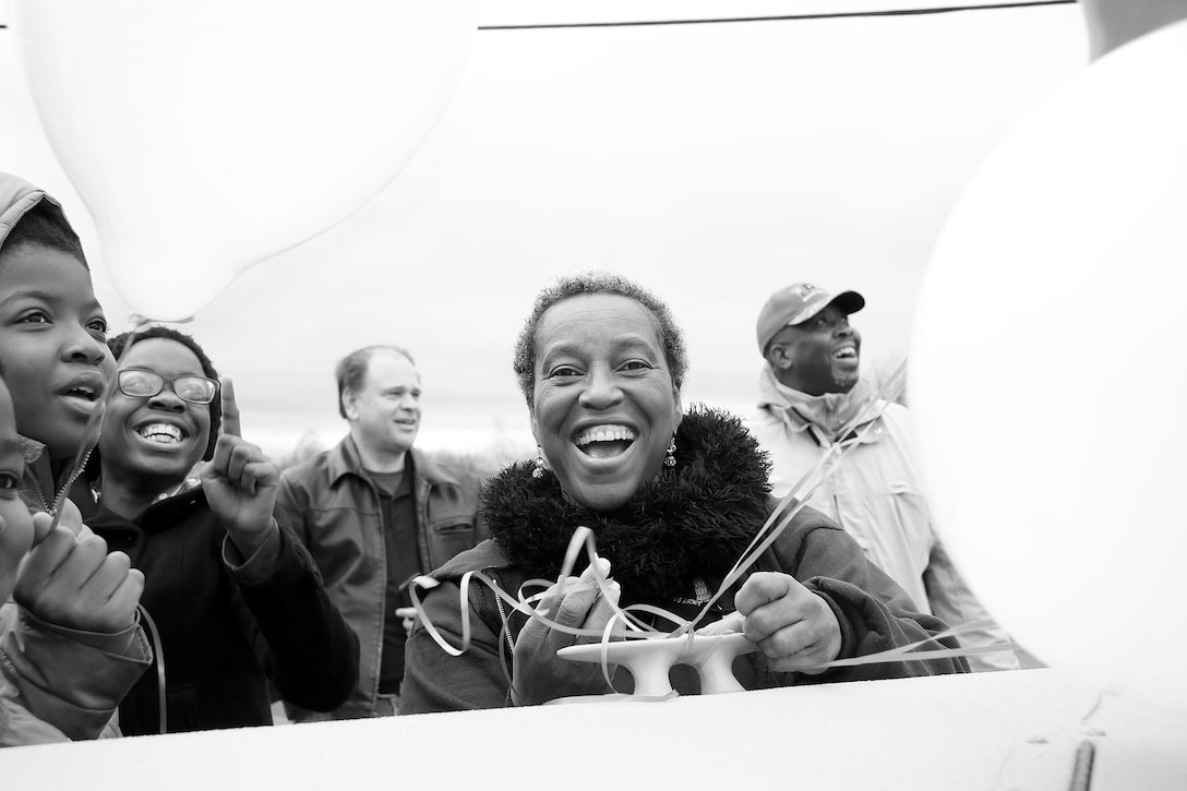 Ms. Joyice Yarbrough, Senior Program Analyst, Tulsa District, U.S. Army Corps of Engineers, ties balloons onto the front of a boat used by the district during the 38th annual Martin Luther King Jr. Commemorative Parade in Tulsa, Okla., January 16, 2017.   Personnel from the Tulsa District have been participating in the city of Tulsa's MLK Day parade for more than 20 years. (U.S. Army Corps of Engineers photo by Preston Chasteen/Released)