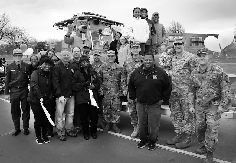 Colonel Christopher Hussin, commander, Tulsa District, U.S. Army Corps of Engineers, and staff volunteers gather around their entry vehicle for the 38th annual Martin Luther King Jr. Commemorative Parade in Tulsa, Okla., January 16, 2017.   Personnel from the Tulsa District have been participating in the city of Tulsa's MLK Day parade for more than 20 years. (U.S. Army Corps of Engineers photo by Preston Chasteen/Released)