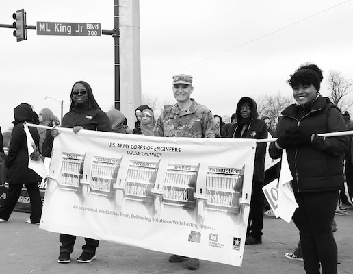 Colonel Christopher Hussin, commander, Tulsa District, U.S. Army Corps of Engineers, and Mrs. Rhonda Leal, left, Equal Employment Opportunity Specialist, along with Ms. Jennifer Stewart, right, Architect, stand on Martin Luther King Jr. Boulevard in preparation to begin marching in the 38th annual Martin Luther King Jr. Commemorative Parade in Tulsa, Okla., January 16, 2017.   Personnel from the Tulsa District have been participating in the city of Tulsa's MLK Day parade for more than 20 years. (U.S. Army Corps of Engineers photo by Preston Chasteen/Released)