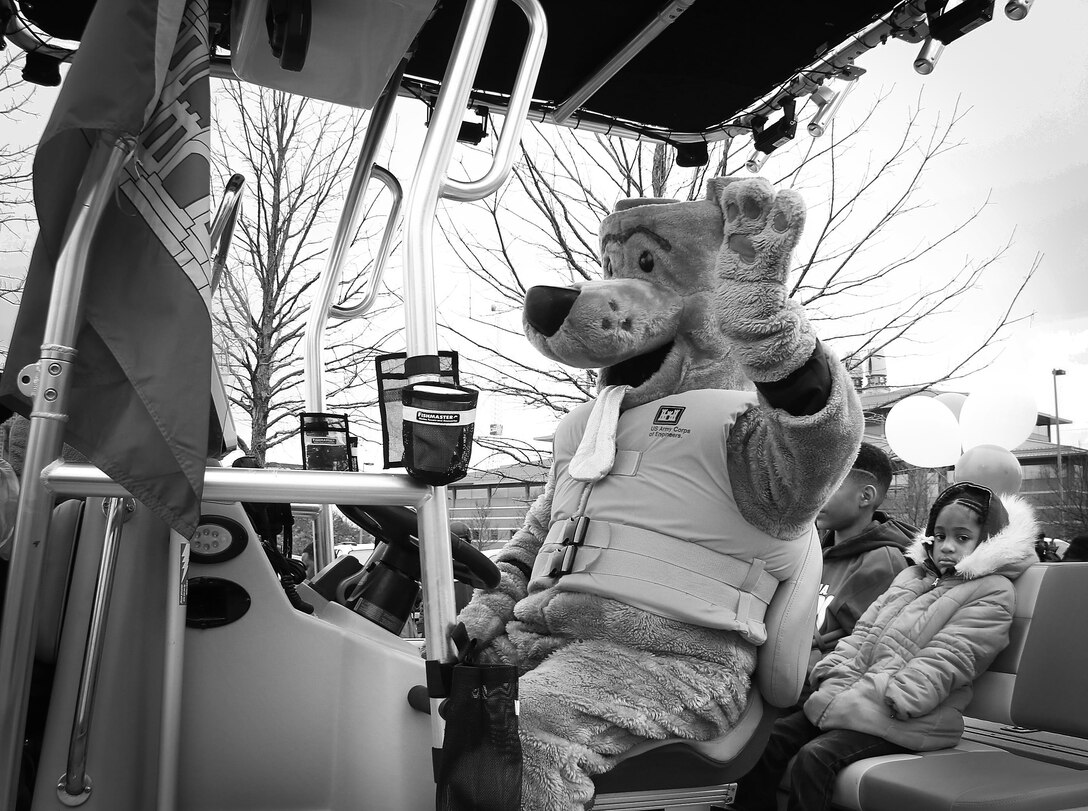 Bobber, the Tulsa District, U.S. Army Corps of Engineers water safety dog, waves to children along the parade route at the 38th annual Martin Luther King Jr. Commemorative Parade in Tulsa, Okla., January 16, 2017.   Personnel from the Tulsa District have been participating in the city of Tulsa's MLK Day parade for more than 20 years. (U.S. Army Corps of Engineers photo by Preston Chasteen/Released)