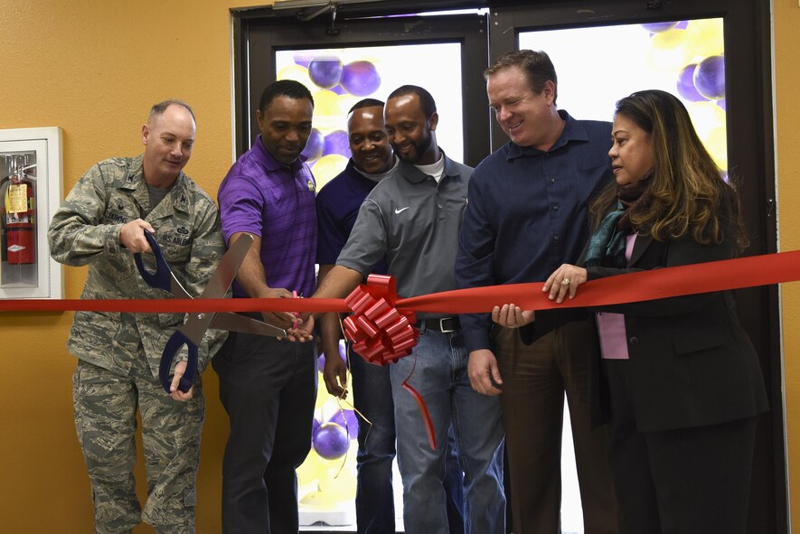 U.S. Air Force Col. Michael Downs, 17th Training Wing Commander, cuts the grand opening ribbon for the new coffee shop on Goodfellow Air Force Base, Texas, Jan. 13, 2017. The coffee shop was officially opened due to popular demand from students and permanent party. (U.S. Air Force photo by Airman 1st Class Chase Sousa/Released)