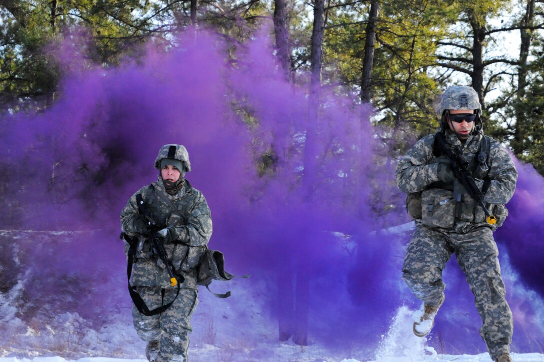 New Jersey Army National Guardsmen advance through smoke cover before assaulting a building during a training exercise at Joint Base McGuire-Dix-Lakehurst, N.J., Jan. 9, 2017. The guardsmen are assigned to the 1st Battalion, 114th Infantry Regiment, 50th Infantry Brigade Combat Team. Army National Guard photo by Sgt. 1st Class Wayne Woolley
