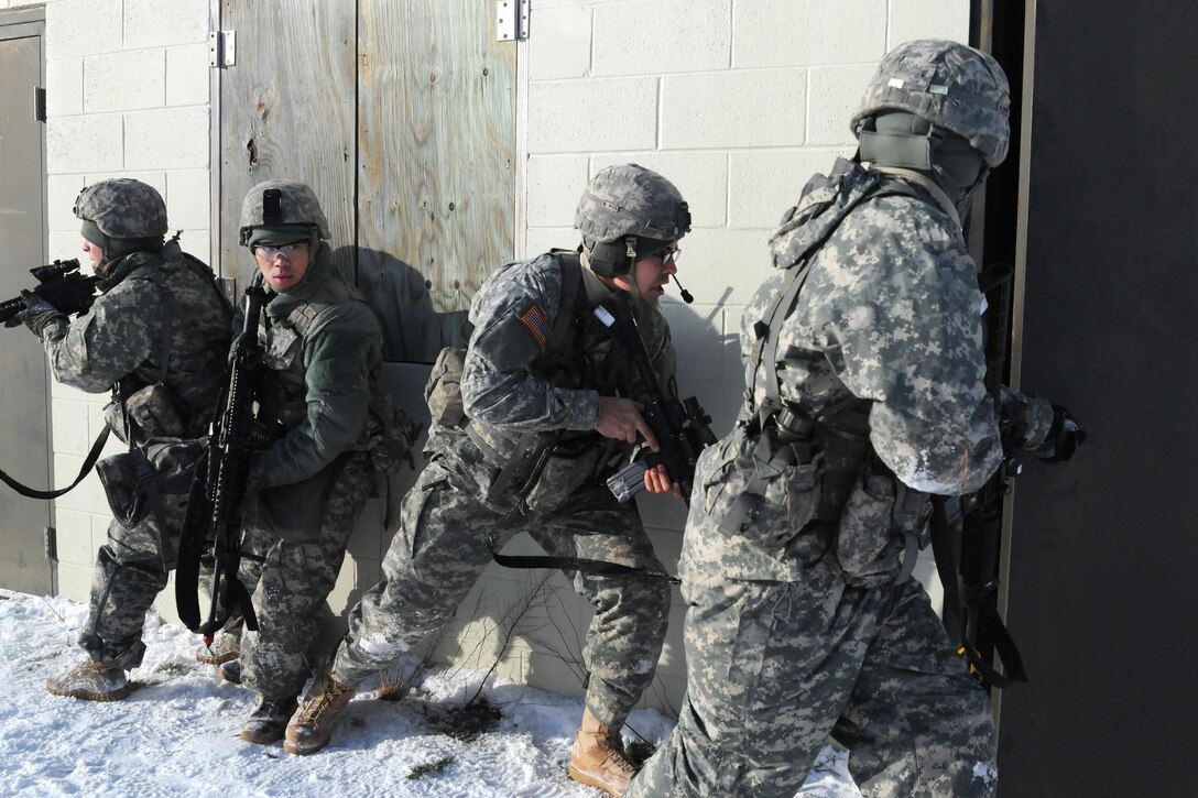 New Jersey Army National Guardsmen breach a door during a training exercise at Joint Base McGuire-Dix-Lakehurst, N.J., Jan. 9, 2017. Army National Guard photo by Sgt. 1st Class Wayne Woolley