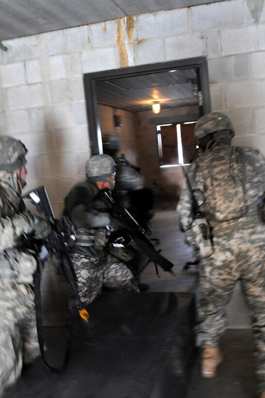 New Jersey Army National Guardsmen search the inside of a building during a training exercise at Joint Base McGuire-Dix-Lakehurst, N.J., Jan. 9, 2017. Army National Guard photo by Sgt. 1st Class Wayne Woolley