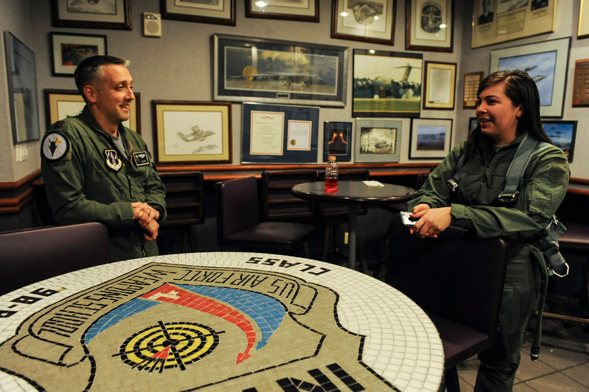 Capt. Josh Hovanas, 433rd Weapons Squadron F-15 Eagle pilot, speaks with Senior Airman Sierra Elliott, 57th Maintenance Squadron munitions specialist, before an incentive flight at Nellis Air Force Base, Nev., Jan. 6, 2017. Elliott was one of 29 Airmen assigned to the 57th Wing who received incentive flights in an F-15 Eagle, F-15E Strike Eagle or F-16 Fighting Falcon during the wing’s annual incentive fly day.