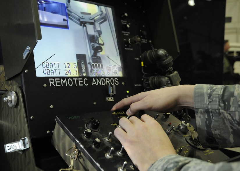 Senior Airman Hunter Eckwall, 11th Civil Engineer Squadron explosive ordnance disposal team member, operates an F6A EOD robot using a control panel during media day at Joint Base Andrews, Md. Jan. 13, 2017. The media day served as a means for local and national media members to interview Air Force subject matter experts and view demonstrations by teams who are preparing for the 58th Presidential Inauguration. (U.S. Air Force Photo by Staff Sgt. Stephanie Morris)
