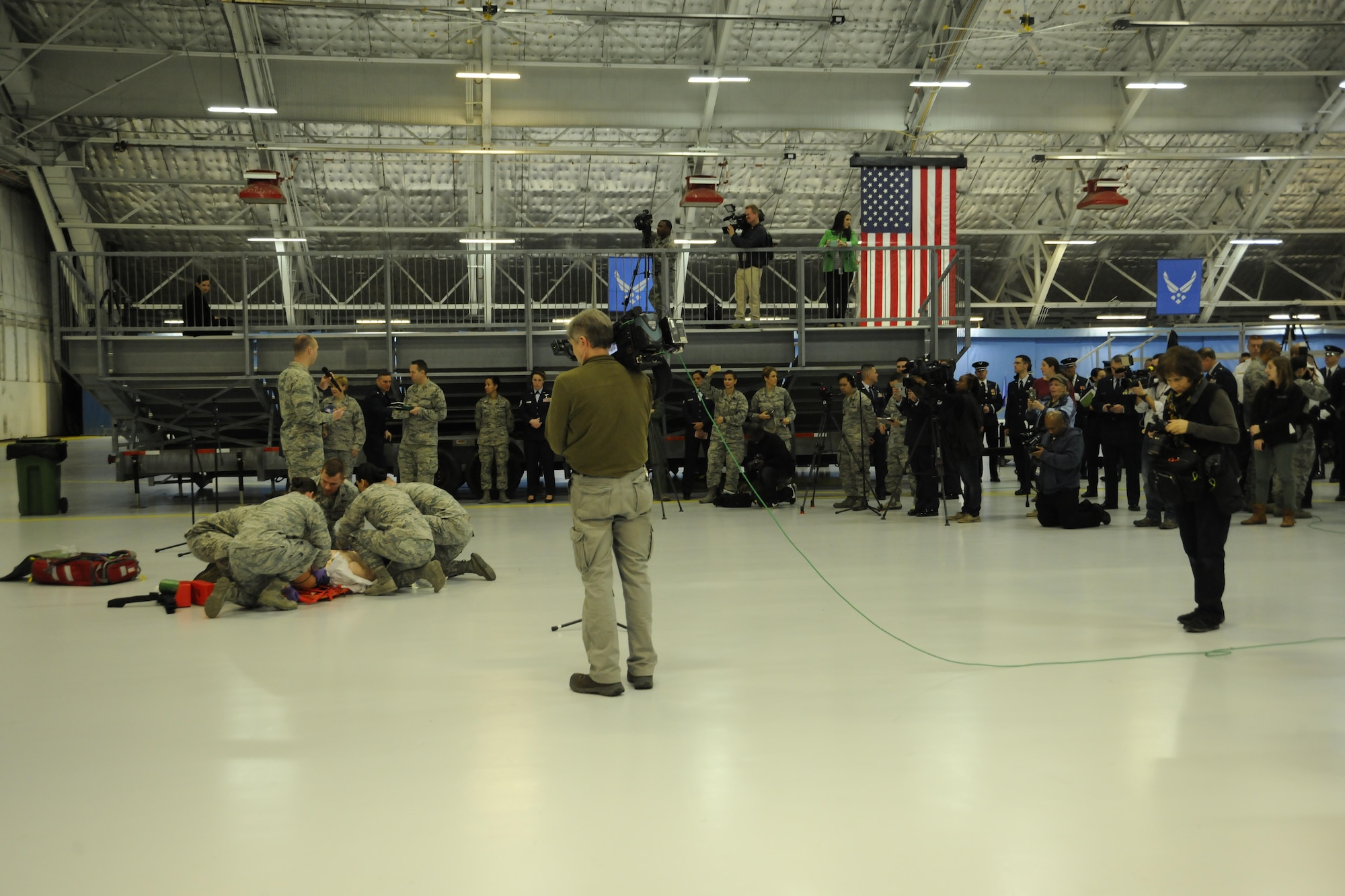 Members of the media view a casualty response demonstration by members of the 79th Medical Wing during media day at Joint Base Andrews, Md. Jan. 13, 2017. The media day served as a means for local and national media members to interview subject matter experts and view demonstrations by teams who are preparing for the 58th Presidential Inauguration. (U.S. Air Force Photo by Staff Sgt. Stephanie Morris)