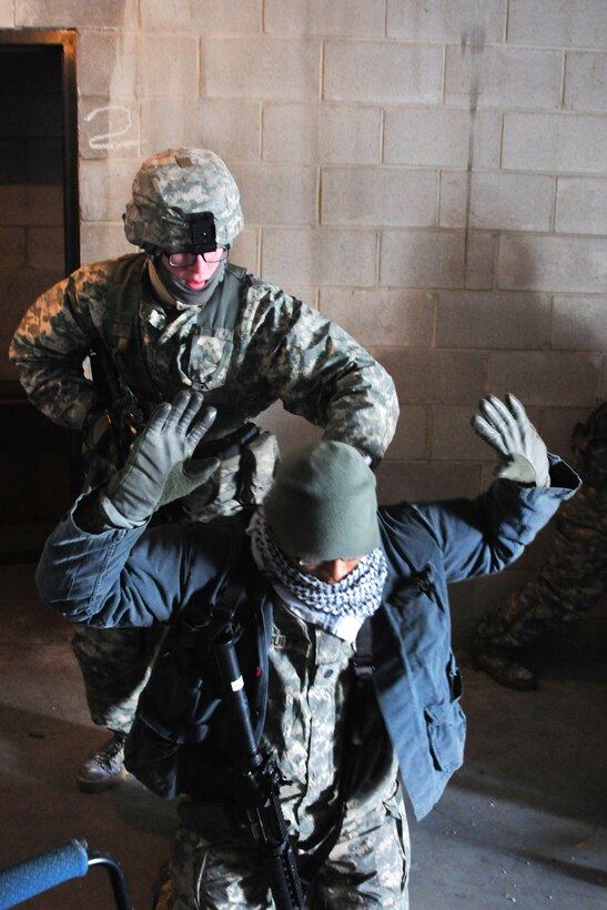 New Jersey Army National Guardsmen secure a mock high-value suspect during a training exercise at Joint Base McGuire-Dix-Lakehurst, N.J., Jan. 9, 2017. Army National Guard photo by Sgt. 1st Class Wayne Woolley