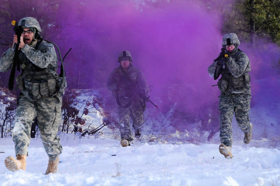 New Jersey Army National Guardsmen advance through smoke cover during a training exercise at Joint Base McGuire-Dix-Lakehurst, N.J., Jan. 9, 2017. Army National Guard photo by Sgt. 1st Class Wayne Woolley