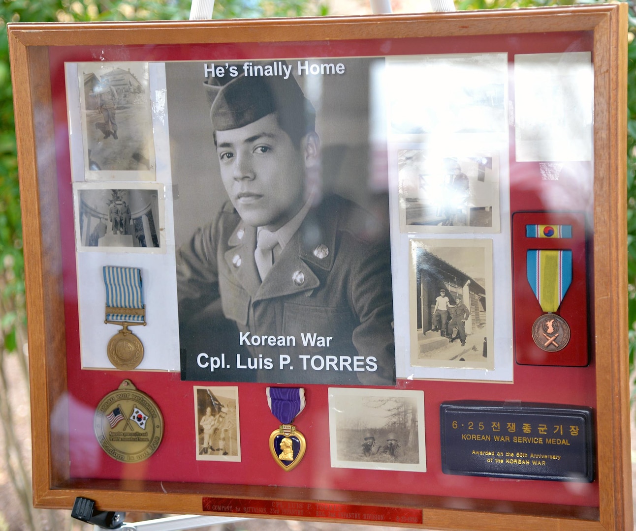 A shadow box displays some photos and medals awarded to Cpl. Luis Patlan Torres, who was interred at Fort Sam Houston National Cemetery Jan. 13 after being missing in action since 1950.