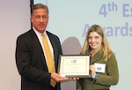 Defense Acquisition Career Manager Robert Daugherty presents DLA’s Joy Mullori the inaugural DACM Chairman’s Award, Jan. 10, 2017, Fort Belvoir, Virginia.