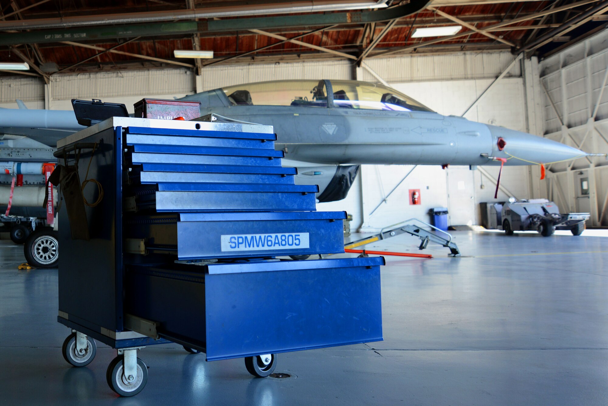 A toolbox sits open in front of an F-16CM Fighting Falcon at Shaw Air Force Base, S.C., Jan. 13, 2017. Toolboxes maintained by 20th Aircraft Maintenance Squadron weapons load crews contain tools U.S. Airmen need for F-16 maintenance and weapons loading. (U.S. Air Force photo by Airman 1st Class Kathryn R.C. Reaves)