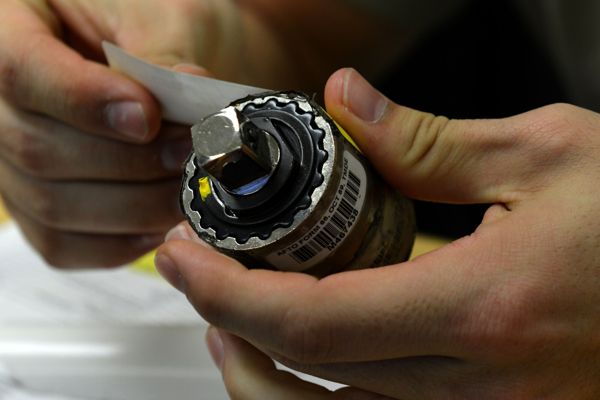 U.S. Air Force Airman 1st Class Jeremiah Zimmer, 20th Component Maintenance Squadron precision measurement equipment laboratory journeyman, places a label onto a calibrated piece of equipment at Shaw Air Force Base, S.C., Dec. 22, 2016. The PMEL flight receives equipment from various flights across the Air Force to calibrate, ensuring the equipment’s accuracy is within a certain range before being sent back to its assigned flight with the appropriate label. The labels indicate date of calibration as well as the next due date for the tool to return to the PMEL flight, the tool’s identification number, and the flight’s stamp. Tools which must maintain accuracy require a PMEL label. (U.S. Air Force photo by Airman 1st Class Destinee Sweeney)