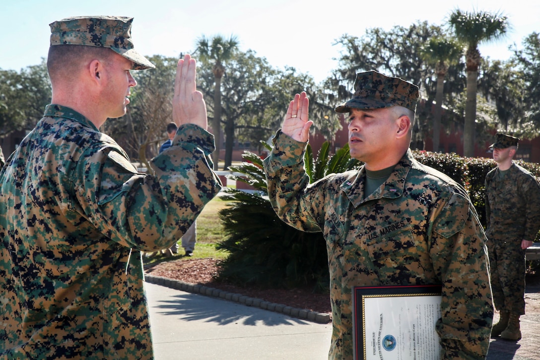 U.S Marine Corps LtCol Paul J. Goguen, operations officer, 6th Marine Corps District (6th MCD), left, leads Chief Warrant Officer 5 Felipe J. Aguilar, personnel officer, 6th MCD, through the Oath of Office during his promotion ceremony at the Iwo Jima Monument aboard Marine Corps Recruit Depot Parris Island, South Carolina, Jan. 17, 2016. The Oath of Office is given to men and women who are commisioned as an officer in the armed services. Members of 6th MCD seek the most upstanding men and women for service in the Marine Corps. (U.S. Marine Corps photo by Lance Cpl Jack A. E. Rigsby/Released)