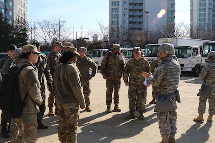 Commander Song Hwan Yun, 32nd Korean Service Corps (KSC) Company, KSC Battalion, explains the wartime host nation support exercise aspect to US Army and Republic of Korea Army personnel at Daebong Elementary School, Jan. 11, 2017.