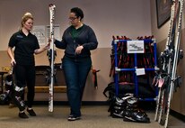 (From left) Ashley Shafer, 5th Force Support Squadron Outdoor Recreation aid, and Dana Sharrit, 5 FSS Outdoor Recreation associate, finish calibrating skis at Minot Air Force Base, N.D., Dec. 2, 2016. Outdoor Rec. is an organization that gives Airmen and their families the opportunity to experience North Dakota events like skiing, snowboarding and dog sledding. (U.S. Air Force photo/Airman 1st Class Jonathan McElderry)