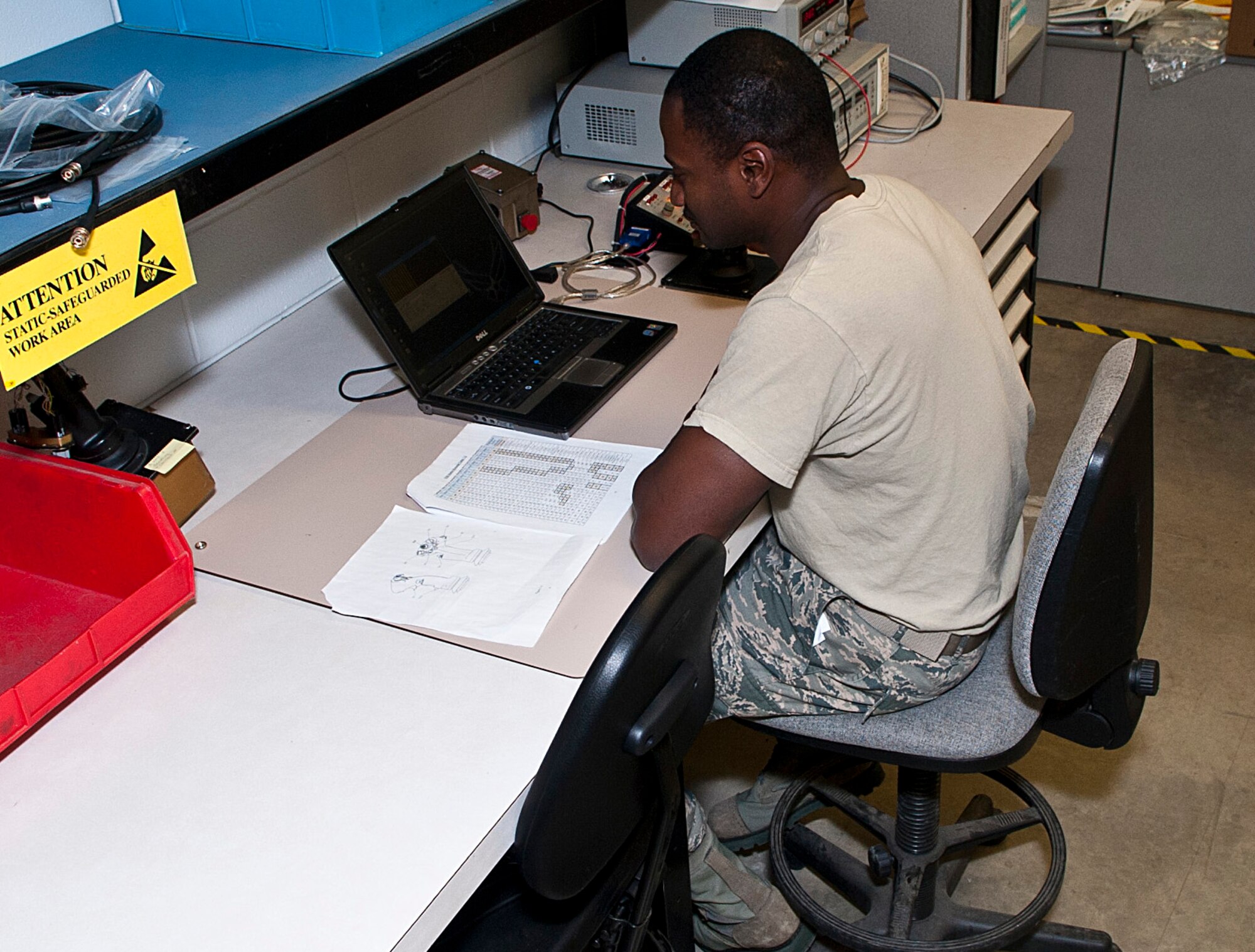 Staff Sgt. Mario Fortenberry, 5th Maintenance Operations flight circuit card repair technician, checks track handle unit functions at Minot Air Force Base, N.D., Jan. 10, 2017. Air Force Repair Enhancement Program Airmen repair damaged connectors, wires, circuit card components and aircraft panels. (U.S. Air Force photo/Airman 1st Class Jonathan McElderry)