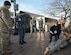 Airman First Class James Horne (left center) and Staff Sgt. Kathryn Cisler (right center), 779th Medical Operations Squadron, train alongside Sailors and Soldiers to simulate first response treatment of a dummy dressed as a military member in the District of Columbia, Jan. 15, 2017. Horne and Cisler are in one of the multiple roving medical teams that will stand ready for any medical emergencies that may occur during the presidential inauguration parade. (U.S. Air Force photo by Staff Sgt. Joe Yanik)