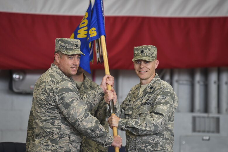 Col. Harry Seibert, left, commander of the 1st Special Operations Maintenance Group, presents Lt. Col. Philip Broyles, commander of the 1st Special Operations Aircraft Maintenance Squadron, with the 1st SOAMXS guidon during an assumption of command ceremony at Hurlburt Field, Fla., Jan. 12, 2017. Broyles previously served as the commander of the 801st Special Operations Aircraft Maintenance Squadron. (U.S. Air Force photo by Airman 1st Class Joseph Pick)