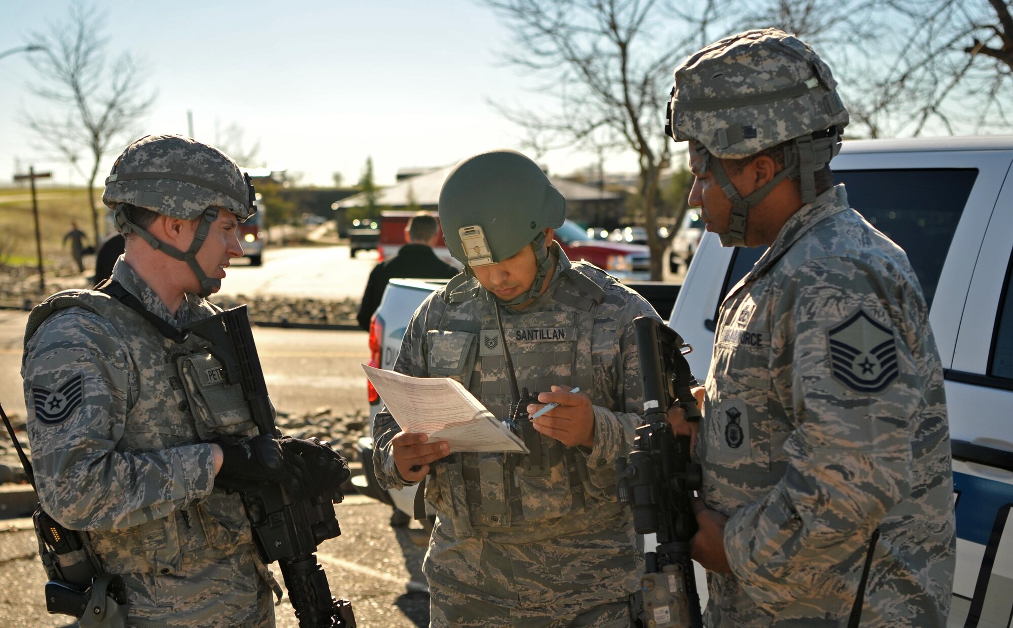 First responders plan the apprehension of the suspect and the recovery of the injured during an active shooter exercise Jan. 13, 2017 at Beale Air Force Base, California. Exercises help prepare Airmen for real world scenarios. (U.S. Air Force photo/Airman Tristan D. Viglianco)