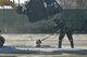 A member of the 374th Civil Engineer Squadron shovels dirt on the ground during a simulated crater repair scenario at Yokota Air Base, Japan, Jan. 12, 2017. In real world scenarios, Airmen will fill the crater with dirt to make it level with the ground to keep the flying mission running. (U.S. Air Force photo by Staff Sgt. David Owsianka)