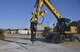 A member of the 374th Civil Engineer Squadron drills a hole in the ground during a simulated crater repair scenario at Yokota Air Base, Japan, Jan. 12, 2017. In a real world scenario, the Airmen will ensure the ground is level prior to placing a mat over the crater to ensure aircraft can land and takeoff from the flight line. (U.S. Air Force photo by Staff Sgt. David Owsianka)
