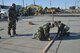 Members of the 374th Civil Engineer Squadron create lines for others to cut the cement during a simulated crater repair scenario at Yokota Air Base, Japan, Jan. 12, 2017. The training provides Airmen with the opportunity to practice and hone their skillset for potential real world scenarios. (U.S. Air Force photo by Staff Sgt. David Owsianka)