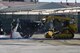 Members of the 374th Civil Engineer Squadron cut part of the cement during a simulated crater repair scenario at Yokota Air Base, Japan, Jan. 12, 2017. In a real world scenario, the Airmen will ensure the ground is level prior to placing a mat over the crater to ensure aircraft can land and takeoff from the flight line. (U.S. Air Force photo by Staff Sgt. David Owsianka)