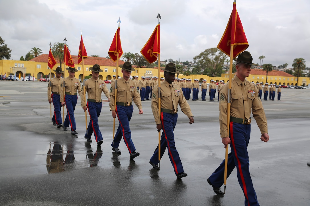 Drill instructors from Fox Company, 2nd Recruit Training Battalion, march in formation after receiving the guidons from the company honormen during the graduation ceremony at Marine Corps Recruit Depot San Diego, Jan. 13. These guidons have been carried by the platoon guides for the duration of training, and this portion of the ceremony marks the disbanding of the platoons. Annually, more than 17,000 males recruited from the Western Recruiting Region are trained at MCRD San Diego.