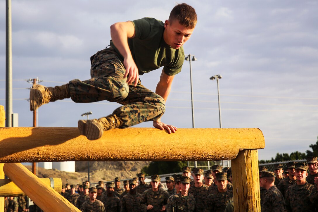 Marine Corps Cpl. Tyler Rolland hurdles an obstacle during the Super Squadron competition at Marine Corps Air Station Yuma, Ariz., Jan. 13, 2017. Rolland is an electrical equipment repair specialist assigned to Marine Air Control Squadron 1. Marine Corps photo by Lance Cpl. George Melendez