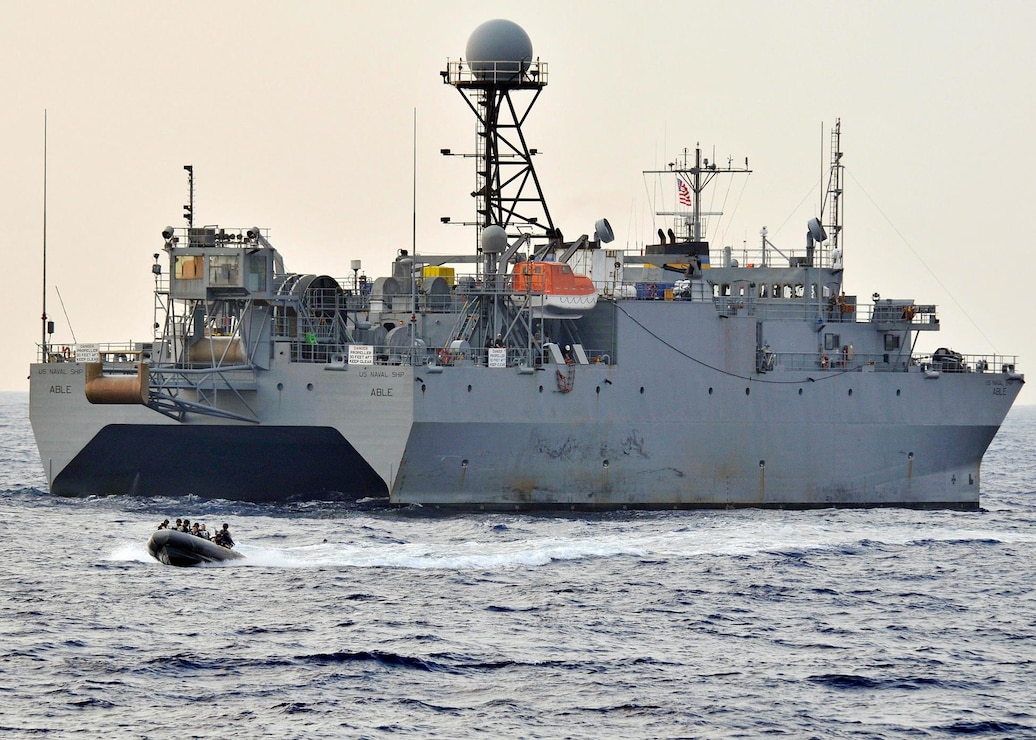 In this file photo, sailors assigned to the visit, board, search and seizure (VBSS) team of the guided-missile destroyer USS Mustin (DDG 89) depart the Military Sealift Command ocean surveillance ship USNS Able (T-AGOS 20) after completing a VBSS drill aboard the vessel, May, 31, 2009. Mustin is one of seven Arleigh Burke-class destroyers assigned to Destroyer Squadron (DESRON) 15 and operates from Yokosuka, Japan.