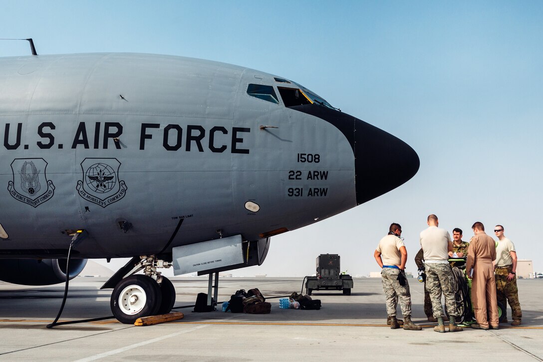 Air Force pilots and crew chiefs conduct a preflight maintenance check before a mission at Al Udeid Air Base, Qatar, Jan. 11, 2017. The pilots and crew chiefs are assigned to the 340th Expeditionary Air Refueling Squadron. The 340th Expeditionary Air Refueling Squadron conducts tactical refueling operations, which extend capabilities across Southwest Asia. Air Force photo by Senior Airman Jordan Castelan