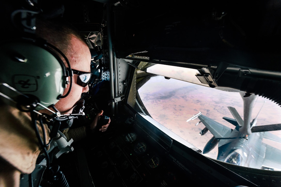 Air Force Senior Airman Casey McConnell watches as he refuels an Air Force F-16 Fighting Falcon over Iraq, Jan. 11, 2017. McConnell is a boom operator assigned to the 340th Expeditionary Air Refueling Squadron. Air Force photo by Senior Airman Jordan Castelan