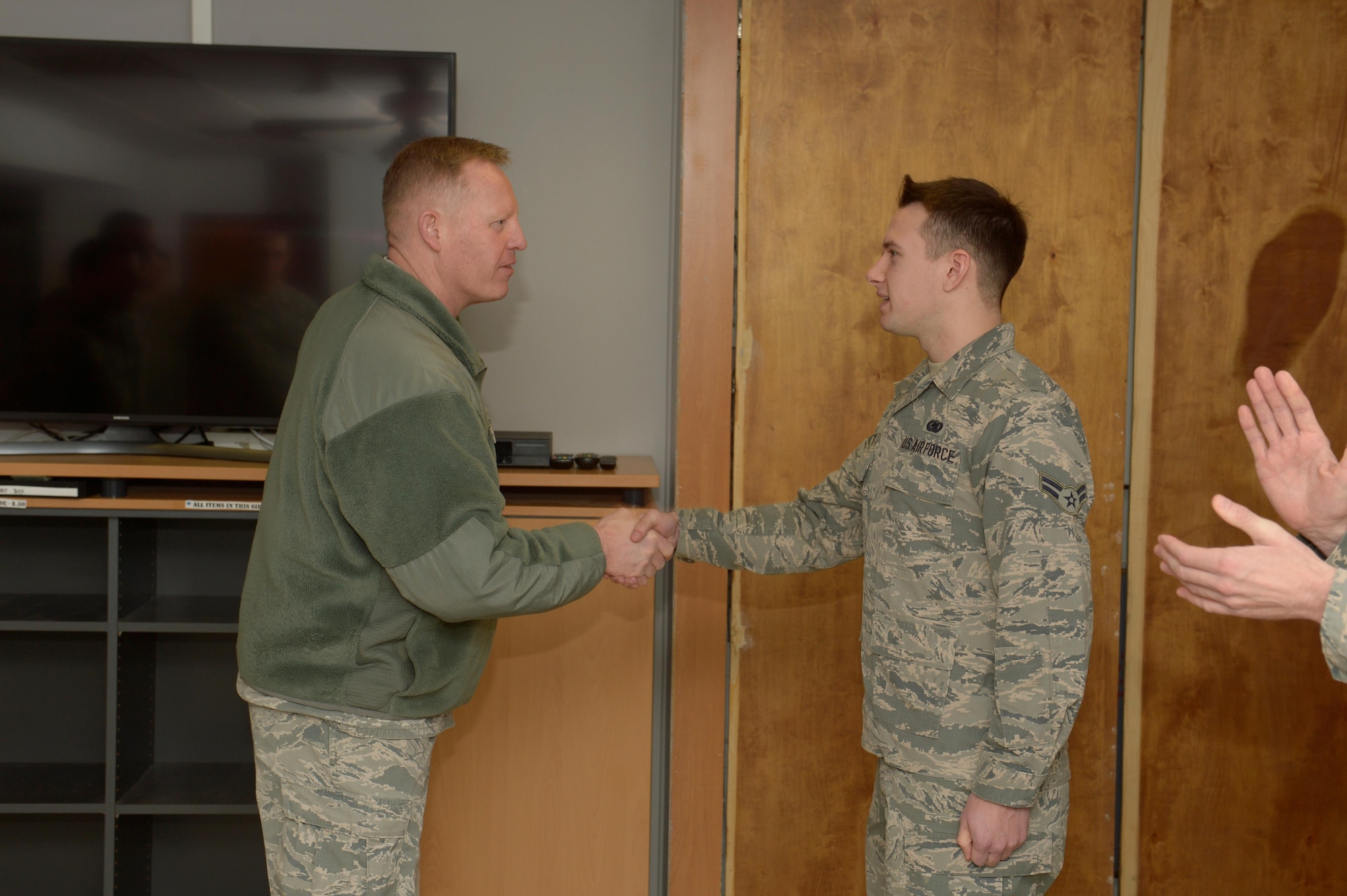 Airman 1st Class Ein Odgers, 52nd Logistics Readiness Squadron fuel distribution operator, is coined by Col. Joe McFall, 52nd Fighter Wing commander, for his actions in a Green Dot social experiment at Spangdahlem Air Base, Germany, Jan. 11, 2017. Green Dot has been conducting several scenarios around base to see how individuals will react to the actors. (U.S. Air Force photo by Staff Sgt.
Jonathan Snyder)