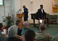 Christian Miley, a high school student, exits the stage after giving a speech during a Martin Luther King Jr. commemoration at Ramstein Air Base, Germany, Jan. 13, 2017. Dr. King was a gifted public speaker at a young age, becoming the youngest assistant manager in his local paper’s history and was a leading member of his high school debate team. (U.S. Air Force photo by Airman 1st Class Lane T. Plummer)