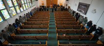 Participants line the walls of their church as they pray during a Martin Luther King Jr. commemoration at Ramstein Air Base, Germany, Jan. 13, 2017. About 15 years after his death, U.S. President Ronald Reagan signed into law the Martin Luther King Jr. Day holiday in 1983, and was first observed three years later. (U.S. Air Force photo by Airman 1st Class Lane T. Plummer)