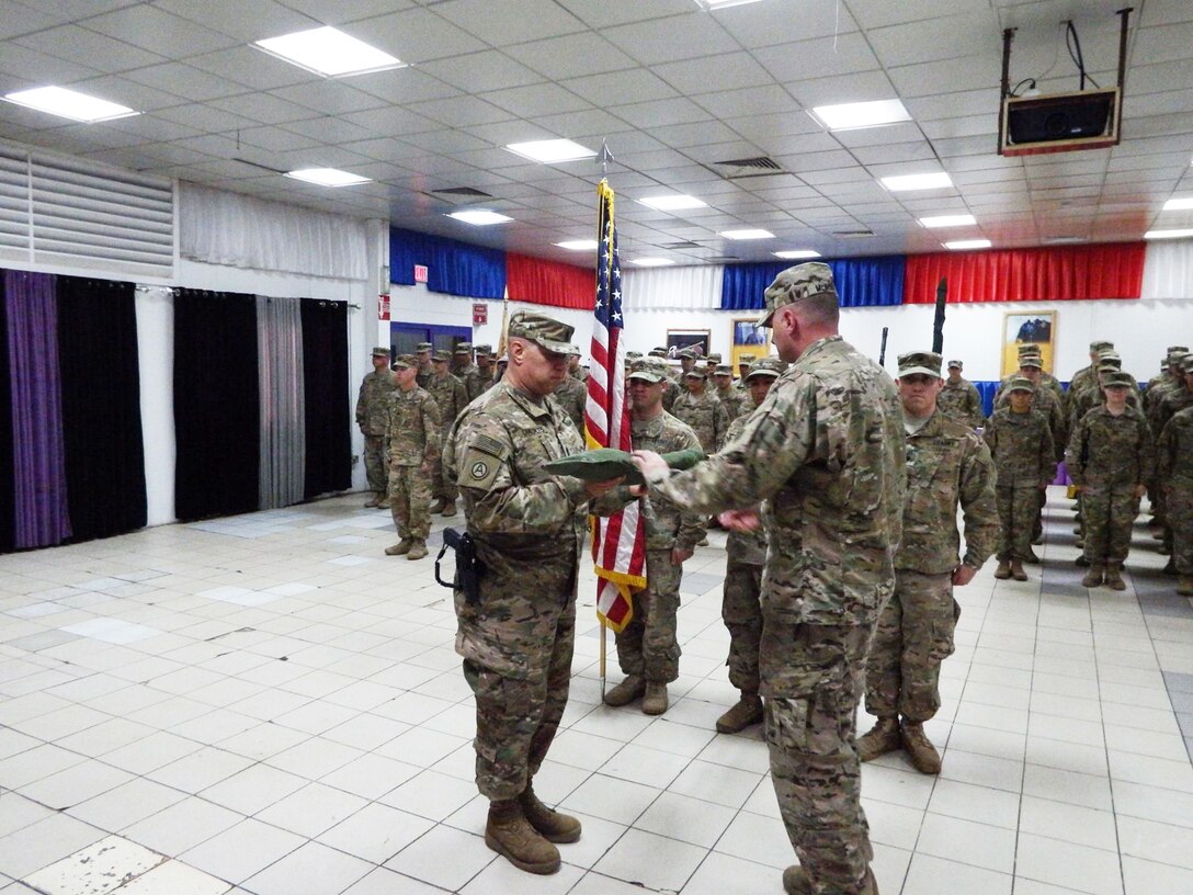 Lt. Col. Kevin McKenzie (right), commander of the 314th Combat Sustainment Support Battalion, and Command Sgt. Maj. Mario Canizales, the senior enlisted advisor of the 314th CSSB, uncase the battalion colors during a transfer of authority ceremony in Iraq on Dec. 29, 2016. The 314th CSSB will provide area sustainment to U.S. and coalition forces, as well as divestiture of the Iraq Train and Equip Fund to the Iraqi Army. 