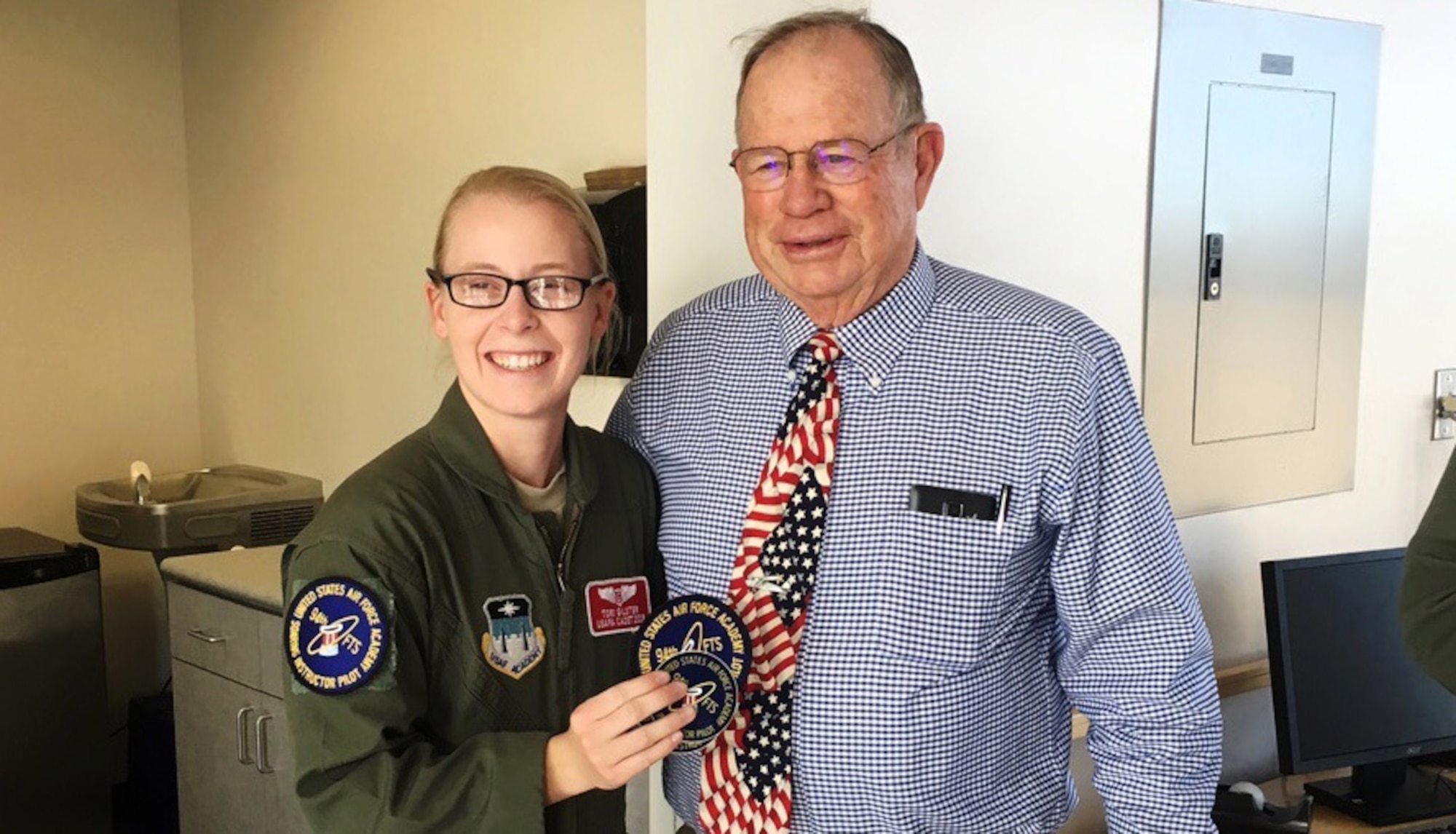 Cadet 2nd Class Tori Gilster and retired Lt. Col. Richard Trail, a graduate of the U.S. Air Force Academy, pose for a photo last fall in the 94th Flying Training Squadron offices. Trail was the first cadet to make a successful solo flight in a glider. He and retired Lt. Col. James Leland visited the Academy to meet cadets and staff and discuss the advances made in the wake of the Air Force's only Soaring Program. Leland helped design the Soaring Program in the 1960s.'(Courtesy photo)  