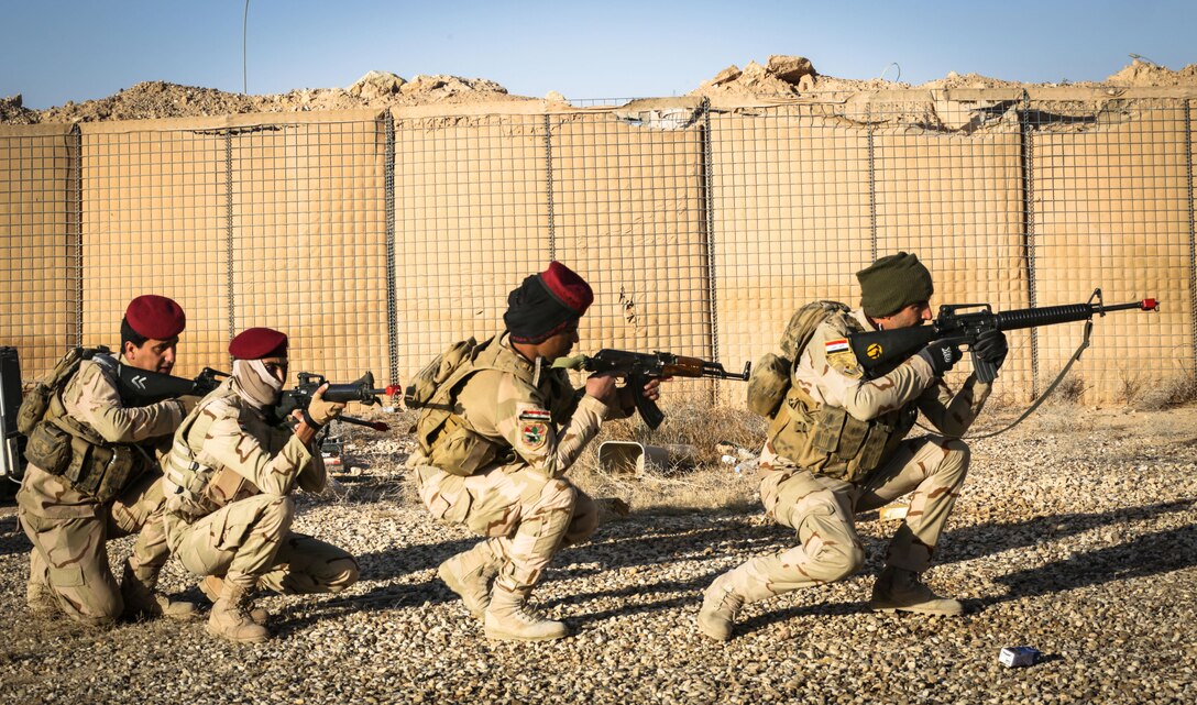 Iraqi soldiers from 7th Iraqi Army Division rehearse a squad maneuver formation during infantry squad training at Al Asad Air Base, Iraq, Jan. 14, 2017. Training at building partner capacity sites is an integral part of Combined Joint Task Force – Operation Inherent Resolve’s global Coalition effort to train Iraqi security forces personnel to defeat ISIL. CJTF-OIR is the global Coalition to defeat ISIL in Iraq and Syria. (U.S. Army photo by Sgt. Lisa Soy)