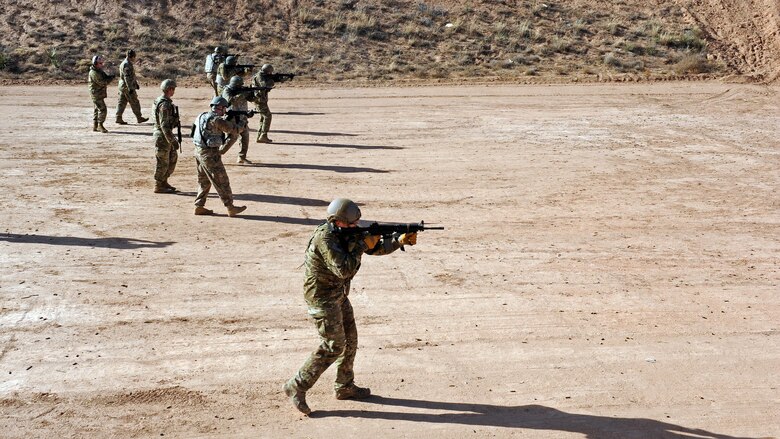 Airmen assigned to Cannon Air Force Base, N.M., participate in M-4 shooting drills during the Green Beret Experience, Dec. 12, 2016. Taught by U.S. Army Green Berets, the Green Beret Experience is a four-day event featuring weapons and ground operations training intended give Airmen an idea of what it’s like to be a member of the Army’s elite ground force. (U.S. Air Force photo by Staff Sgt. Whitney Amstutz/Unreleased)